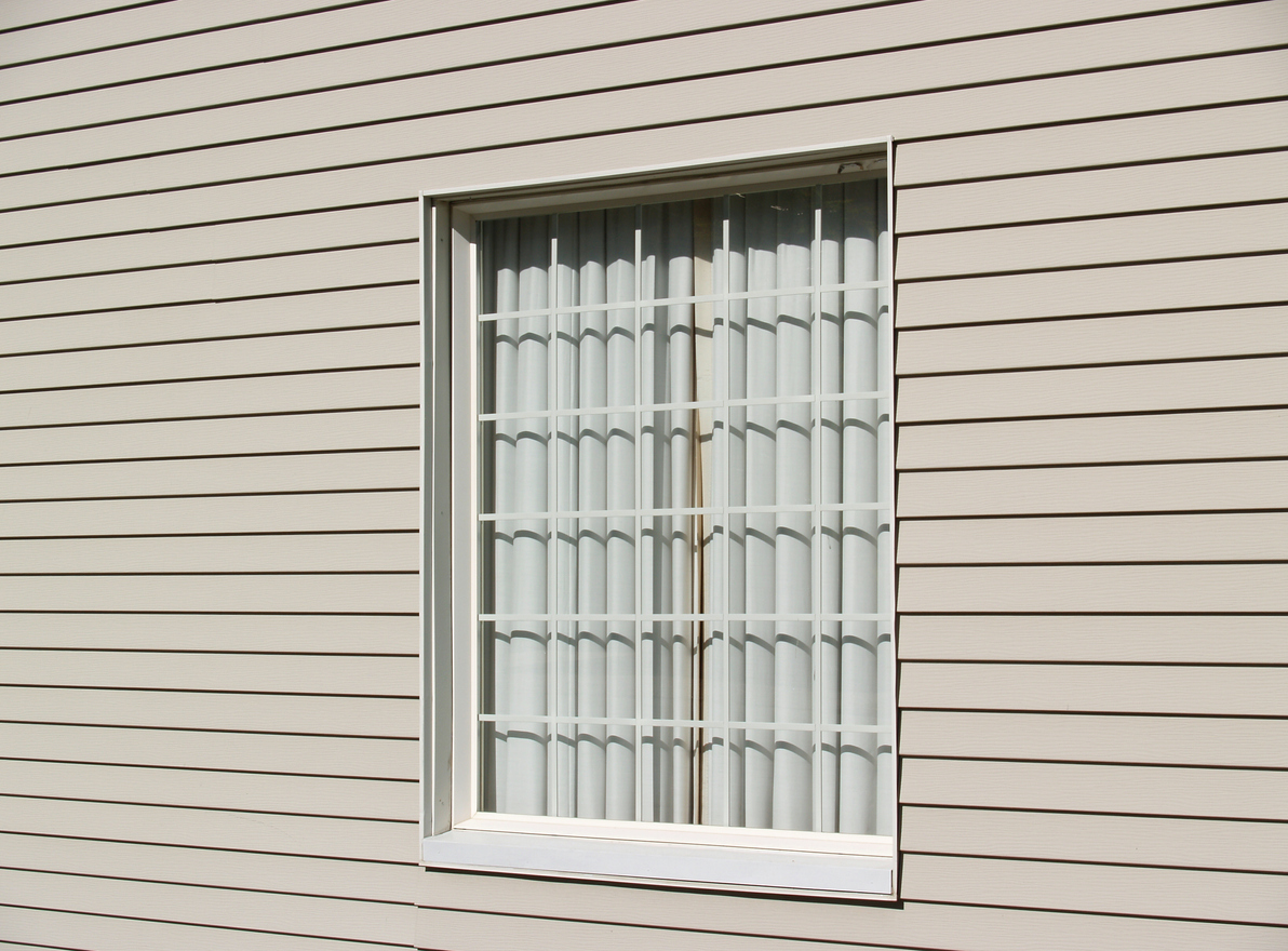 Simple draped window and house siding.
