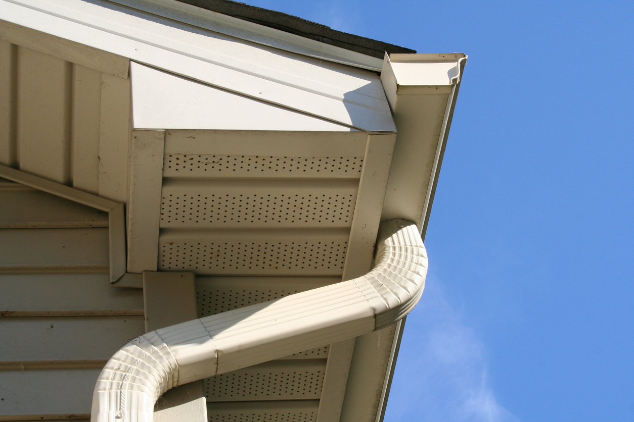 Side view of gutter and downspout on a house