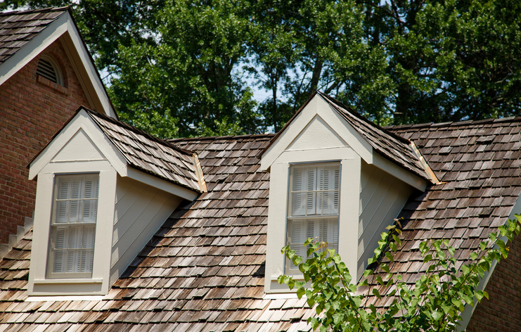 Two Wood Dormers on a wood shingled roof